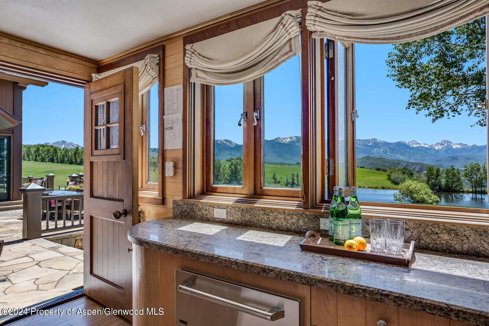 1200 Kessler Drive Aspen, CO 81612 - Photo 20 of 58 a view of swimming pool with a table and chairs in patio