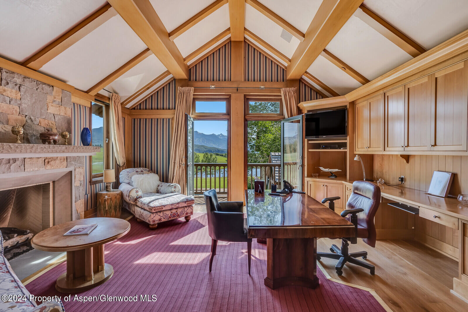 1200 Kessler Drive Aspen, CO 81612 - Photo 27 of 58 a livingroom with furniture fire place and a fireplace