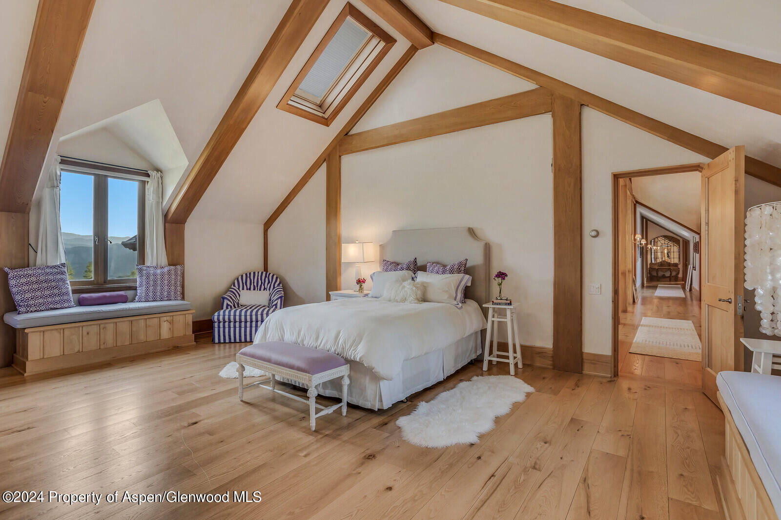 1200 Kessler Drive Aspen, CO 81612 - Photo 34 of 58 a spacious bedroom with a bed and wooden floor
