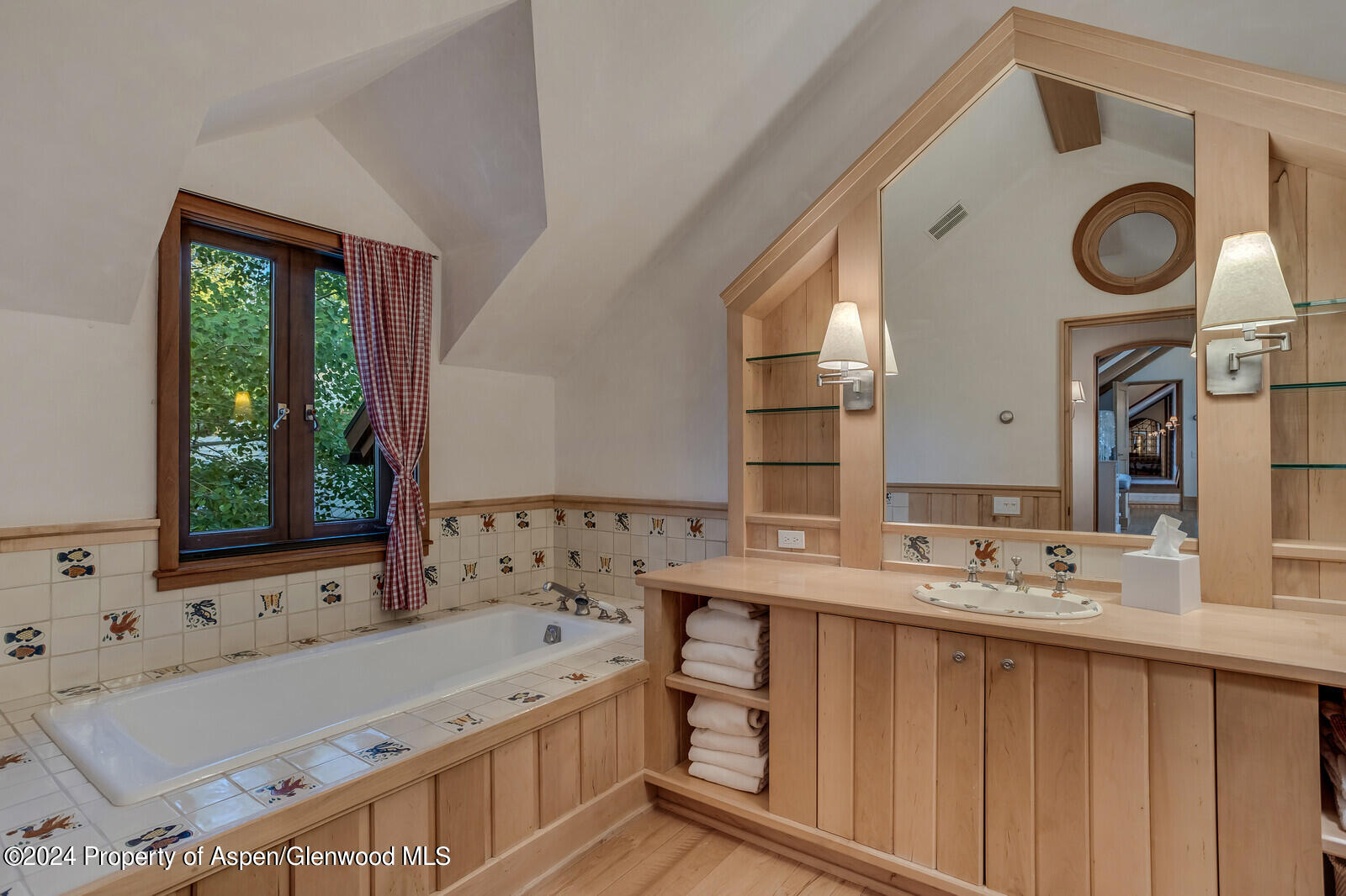 1200 Kessler Drive Aspen, CO 81612 - Photo 35 of 58 a bathroom with a tub sink and mirror