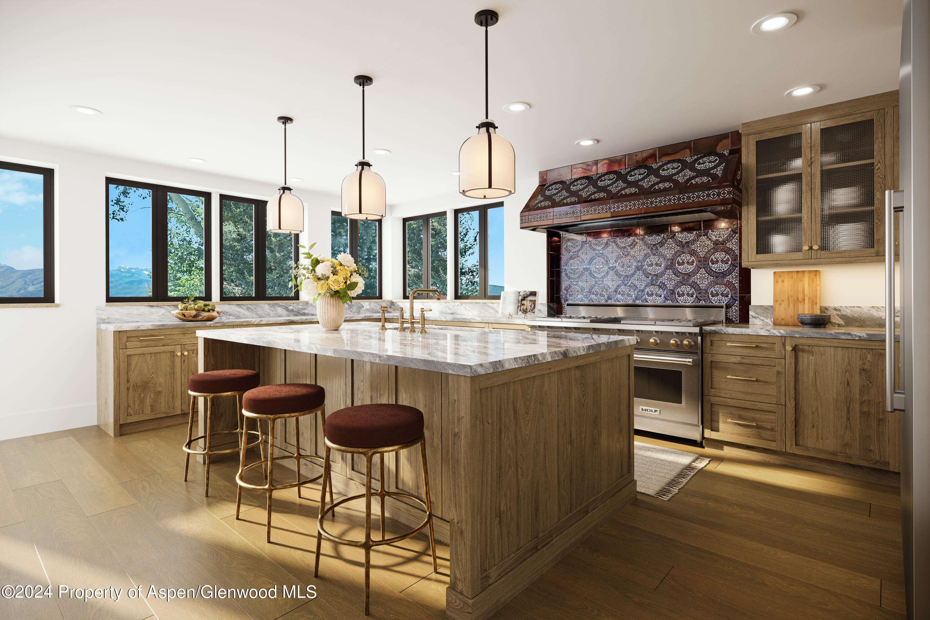 1200 Kessler Drive Aspen, CO 81612 - Photo 54 of 58 a kitchen with stainless steel appliances granite countertop a stove and a wooden floors
