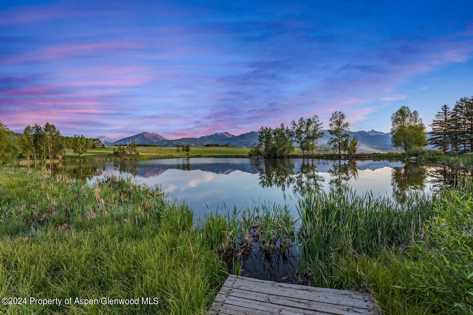 1200 Kessler Drive Aspen, CO 81612 - Photo 8 of 58 a view of a lake with houses in the back
