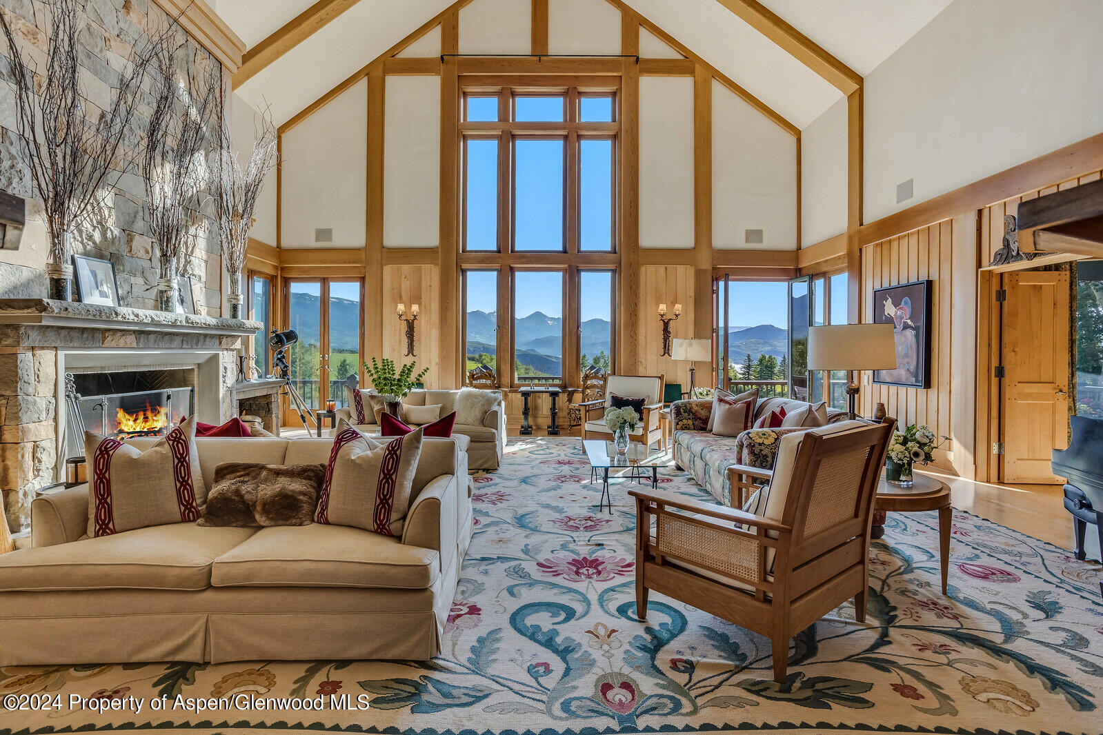 1200 Kessler Drive Aspen, CO 81612 - Photo 10 of 58 a living room with furniture fireplace and a large window