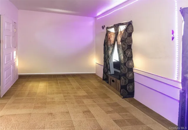 a view of a room with gym equipment and a shower