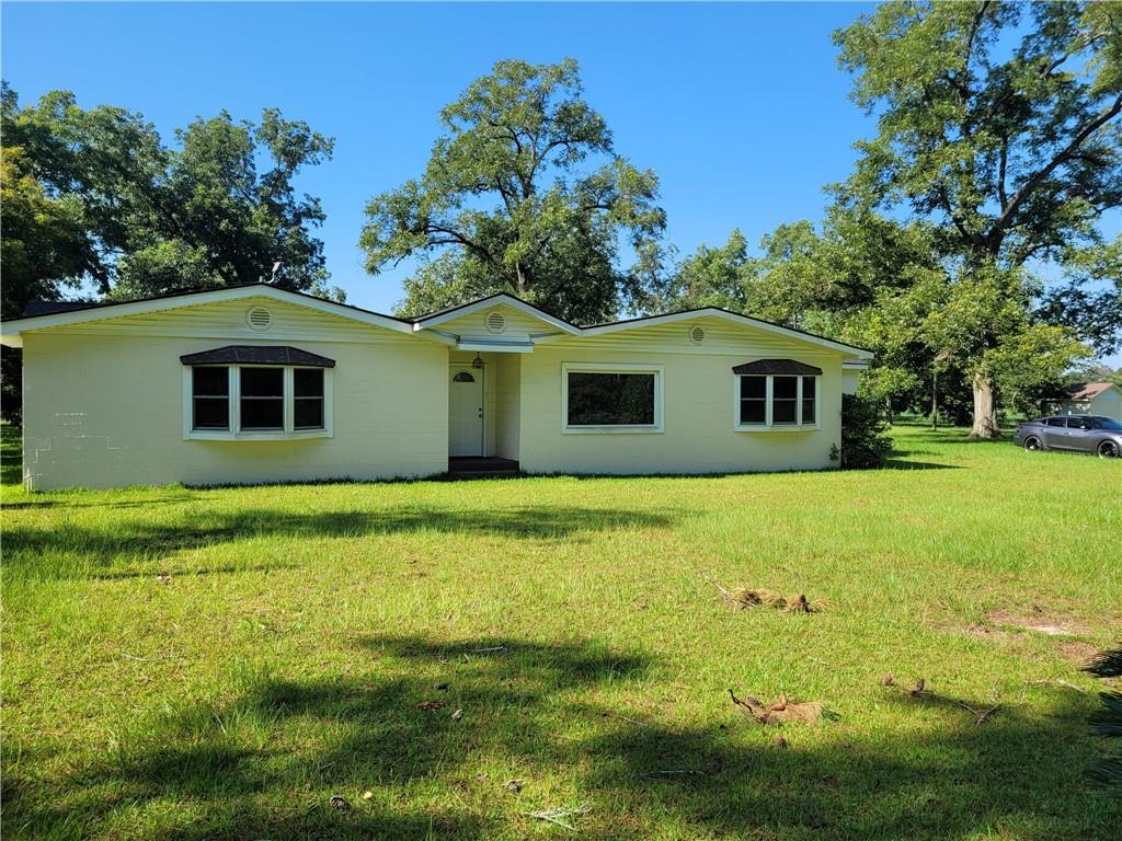 5020 Dry Lake Road Dixie, GA 31629 - Photo 1 of 1 a view of a house with a backyard