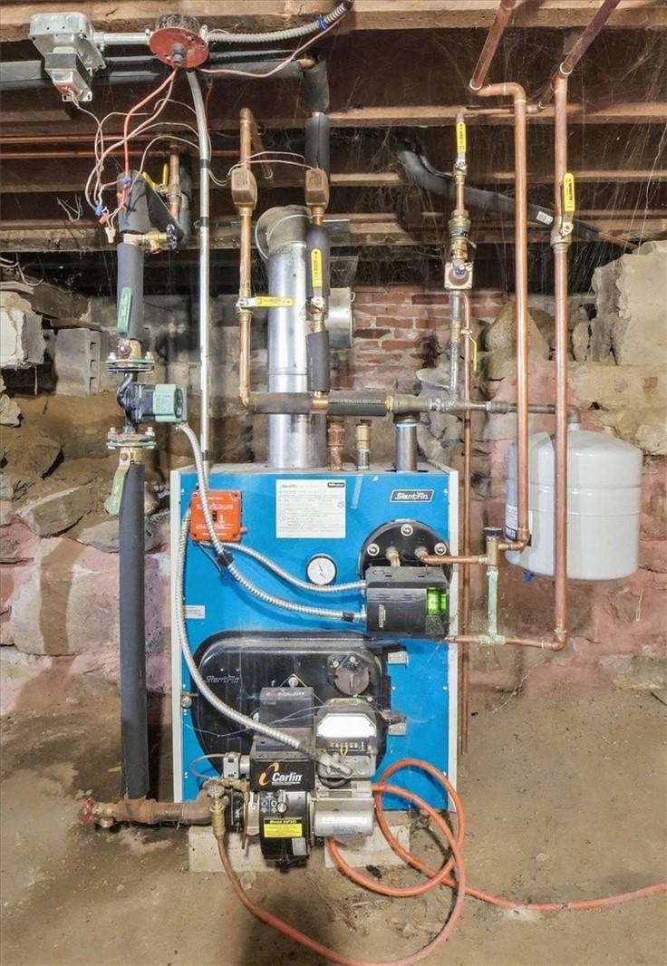 322 Rocky Hill Road Scituate, RI 02857 - Photo 42 of 50 This is a Slant/Fin Intrepid TR-30 HPT — an oil-fired cast iron hot water boiler used for hydronic/baseboard heating systems. These are known for being very durable, dependable boilers.