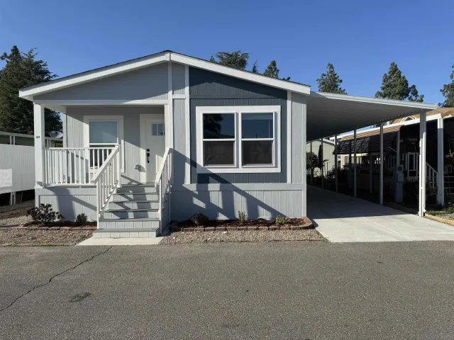 a view of house with outdoor space and porch