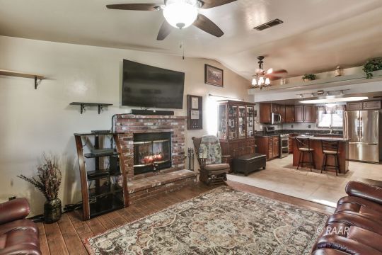 424 Mavis Court Ridgecrest, CA 93555 - Photo 6 of 32 a living room with lots of furniture and a flat screen tv