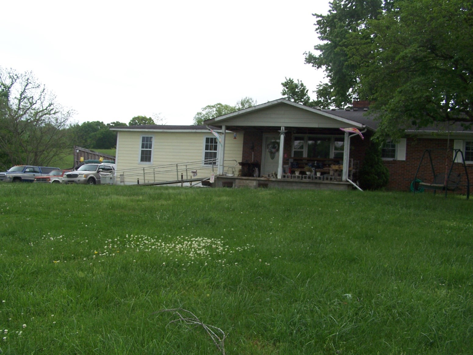 275 Chicken Creek Road Pulaski, TN 38478 - Photo 1 of 22 a view of a house with a yard and sitting area