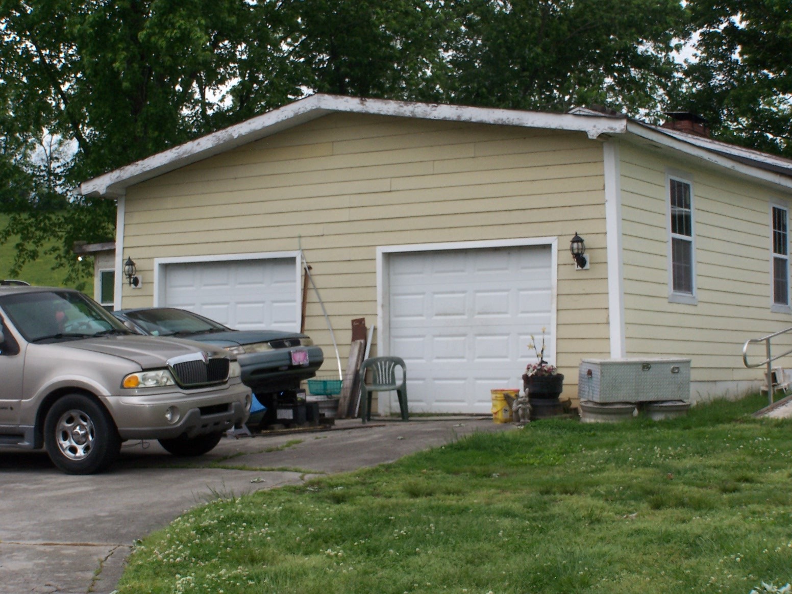275 Chicken Creek Road Pulaski, TN 38478 - Photo 13 of 22 a couple of cars parked in front of a house