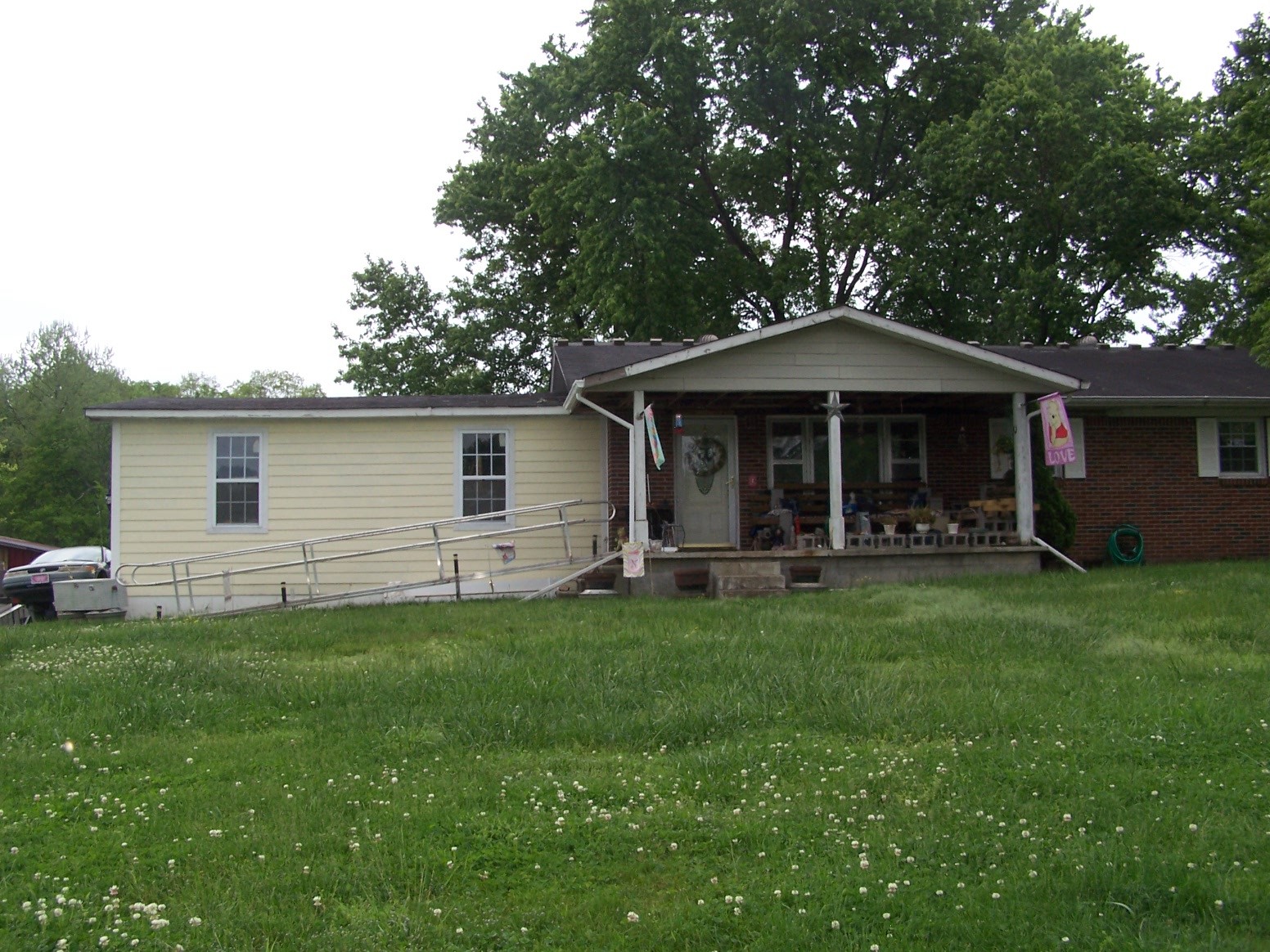 275 Chicken Creek Road Pulaski, TN 38478 - Photo 16 of 22 a front view of a house with a garden
