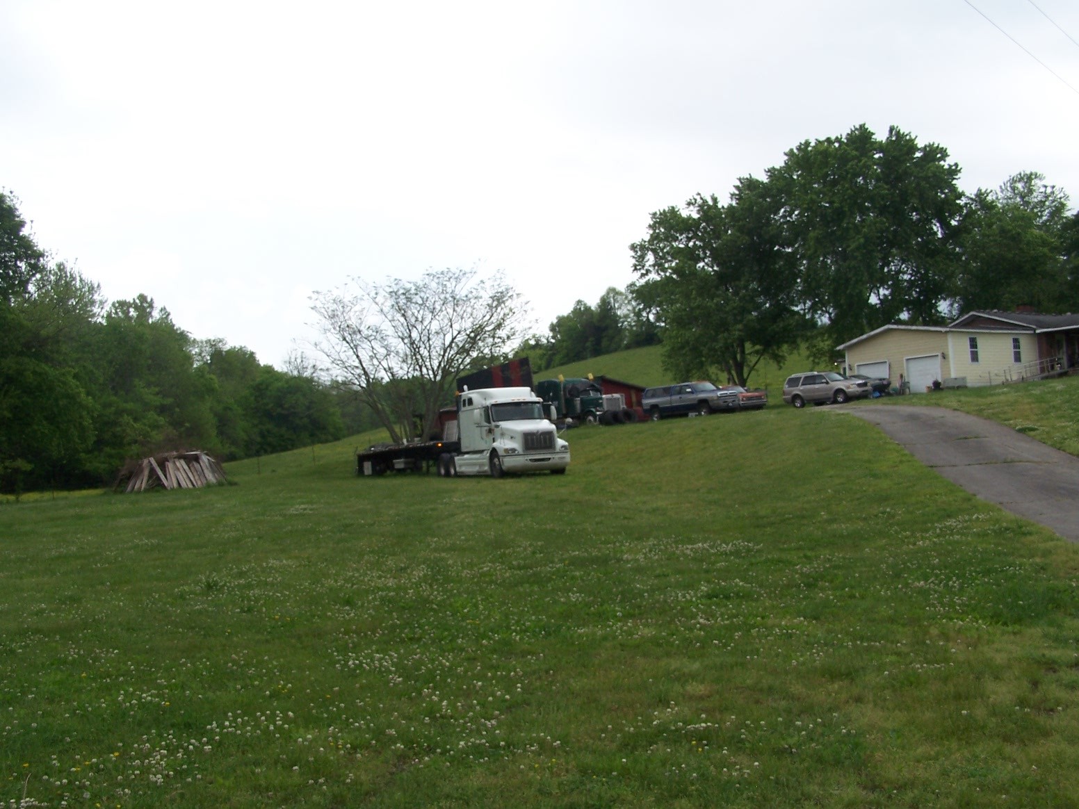 275 Chicken Creek Road Pulaski, TN 38478 - Photo 17 of 22 a car parked in the grass near a house