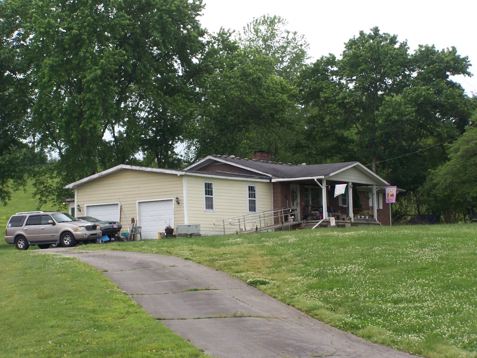 275 Chicken Creek Road Pulaski, TN 38478 - Photo 19 of 22 a front view of a house with a garden