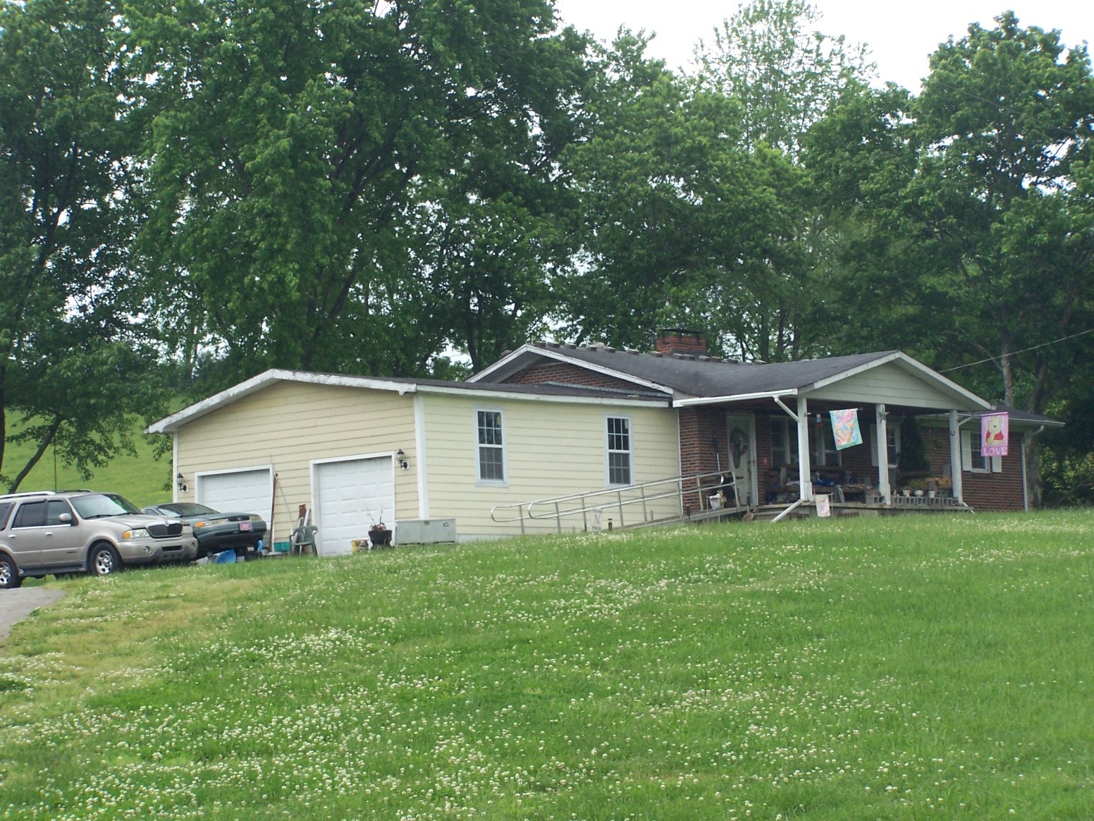 275 Chicken Creek Road Pulaski, TN 38478 - Photo 20 of 22 a front view of a house with a garden