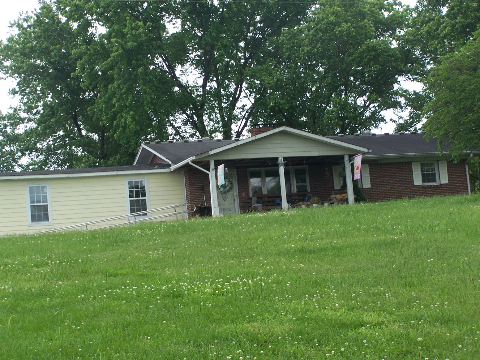 275 Chicken Creek Road Pulaski, TN 38478 - Photo 21 of 22 a front view of a house with a garden