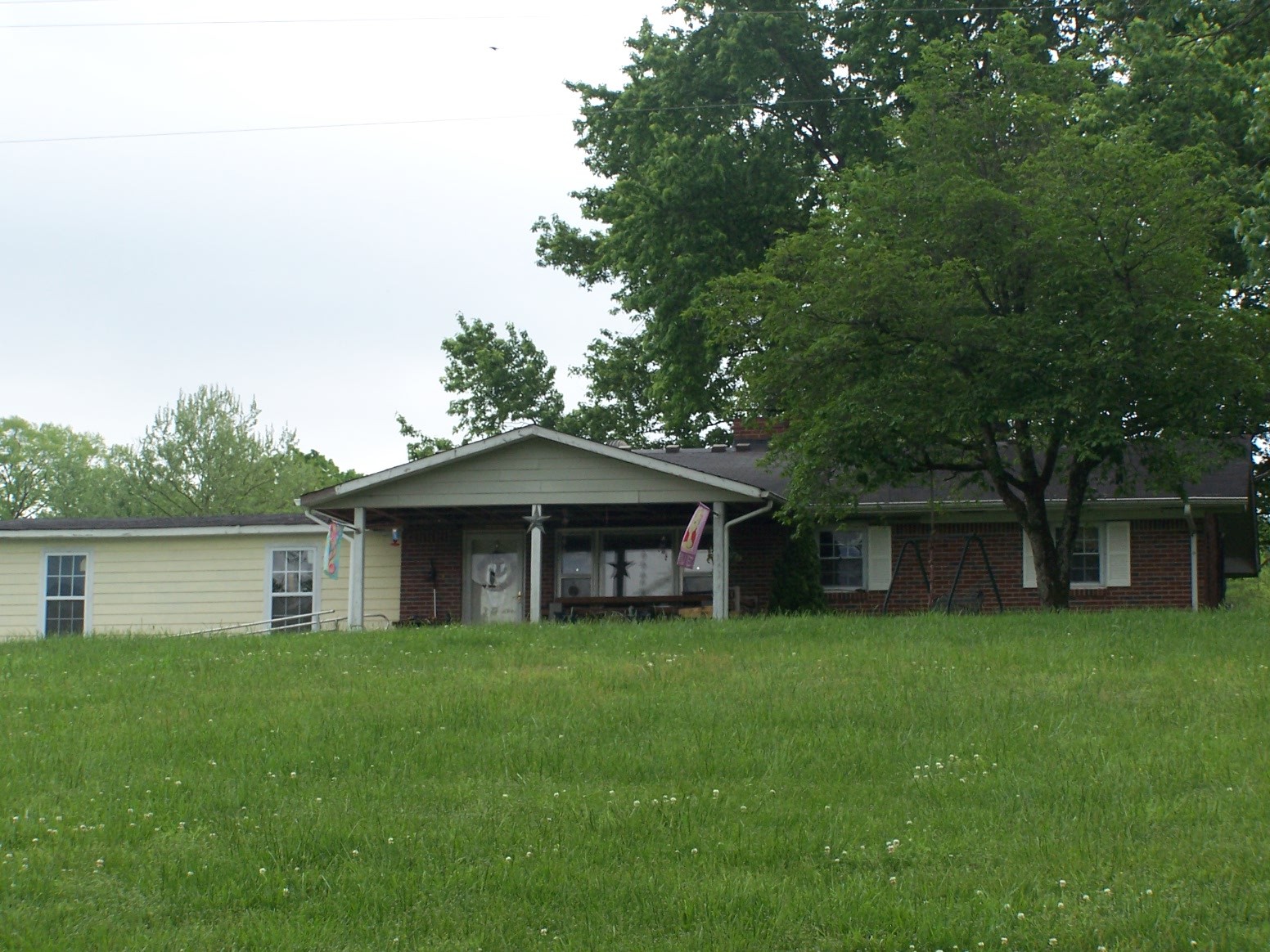 275 Chicken Creek Road Pulaski, TN 38478 - Photo 22 of 22 a front view of a house with garden
