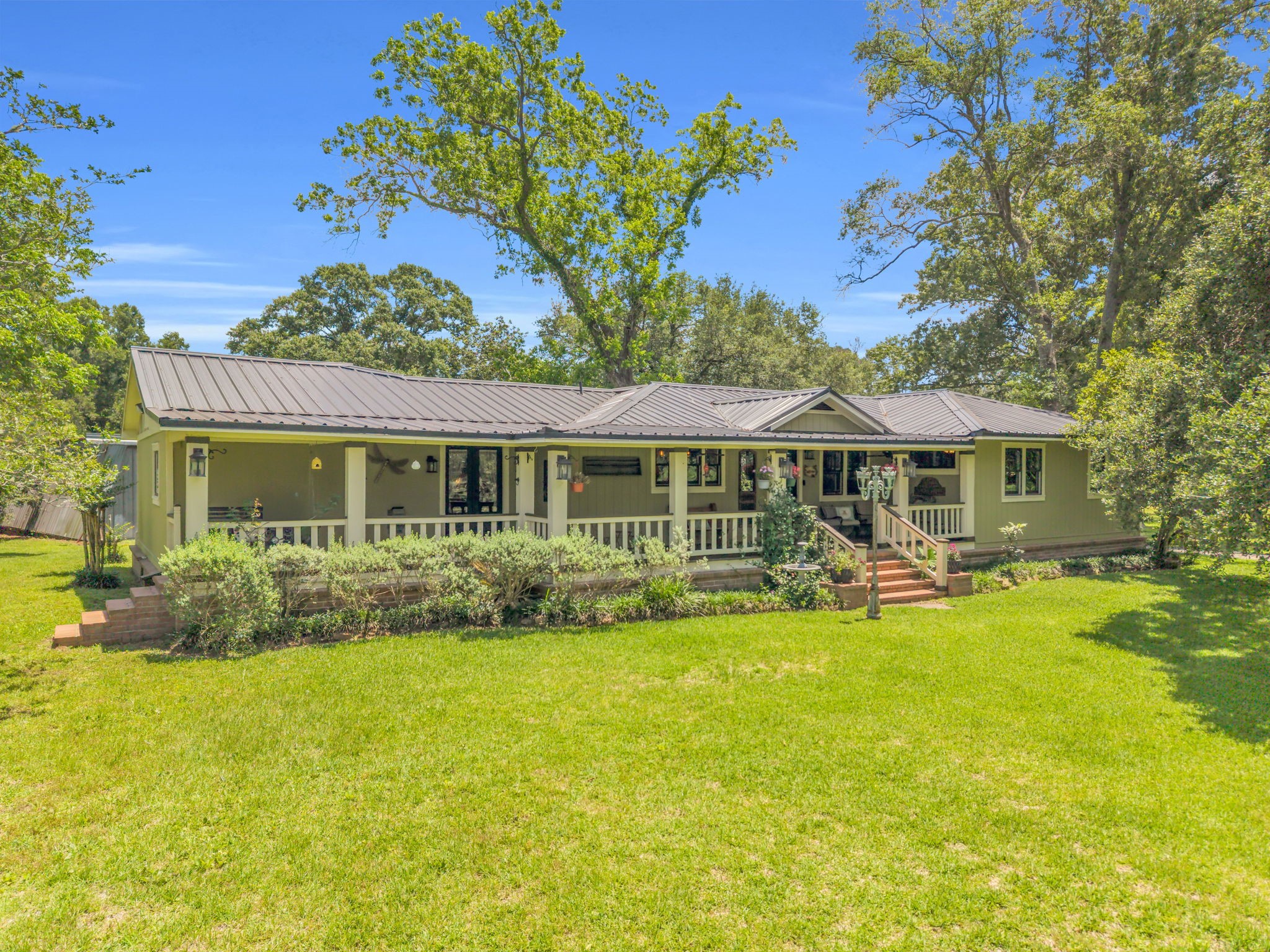 17821 Brown Road Conroe, TX 77306 - Photo 1 of 50 a front view of a house with swimming pool having outdoor seating
