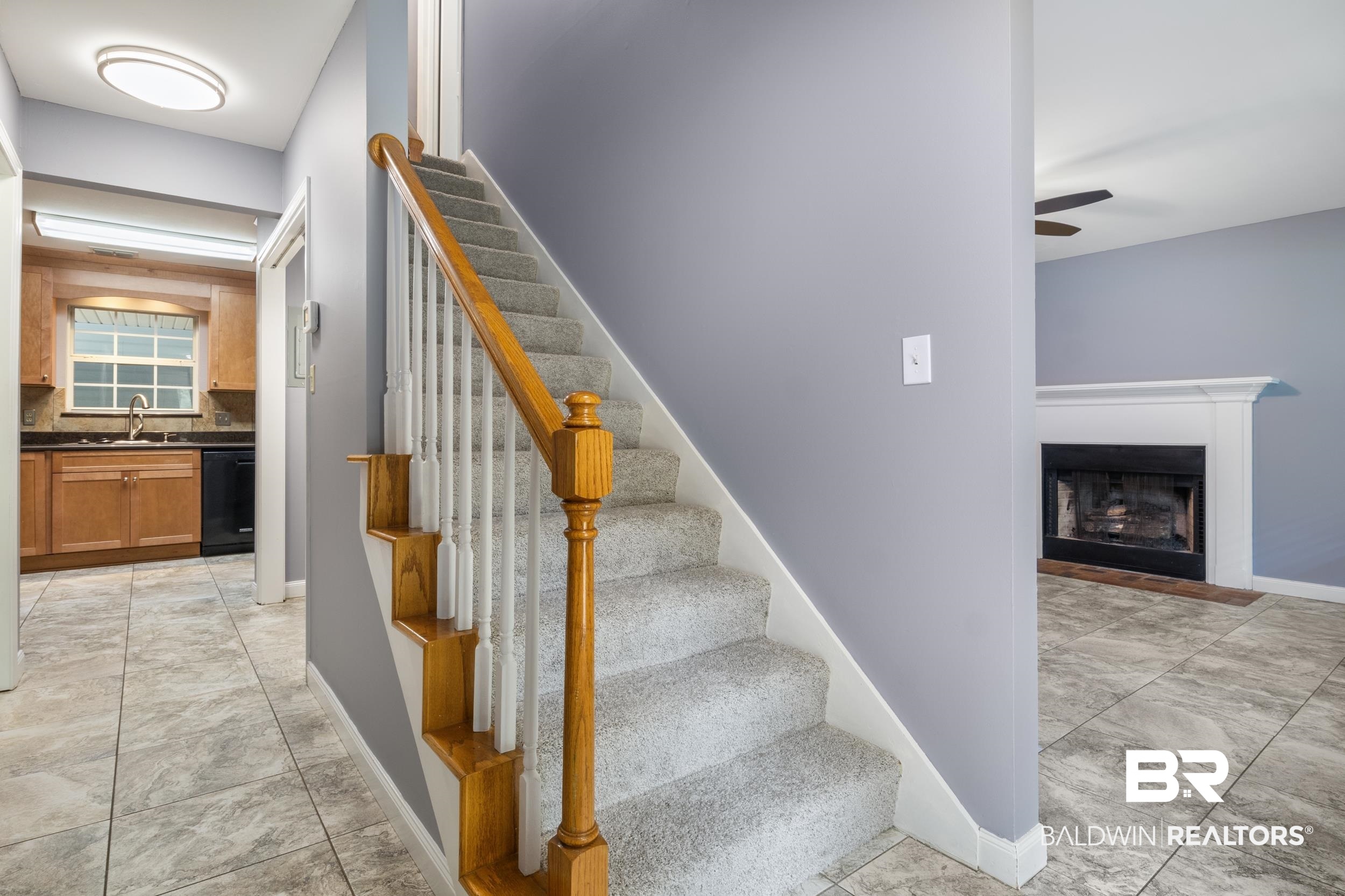 150 Montclair Loop Daphne, AL 36526 - Photo 24 of 29 Stairs featuring sink, light tile flooring, and ceiling fan
