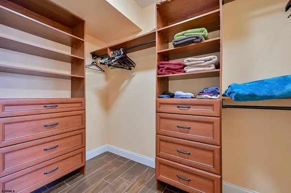 a bedroom with a bed and ceiling fan