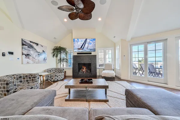 a living room with furniture fireplace and window
