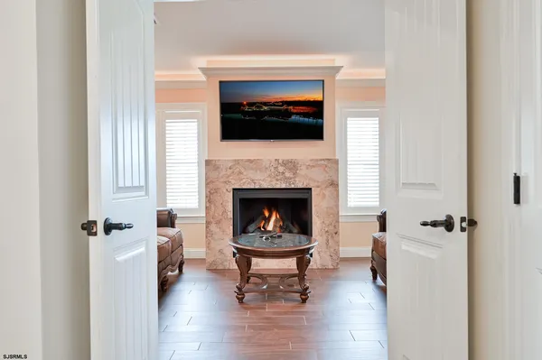 a kitchen with stainless steel appliances kitchen island granite countertop a sink a counter space and cabinets