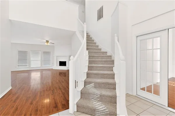 a view of an entryway with wooden floor and door
