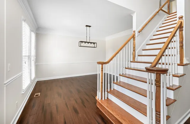 a view of entryway with wooden floor