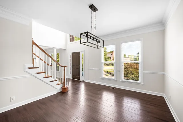 a view of entryway with wooden floor