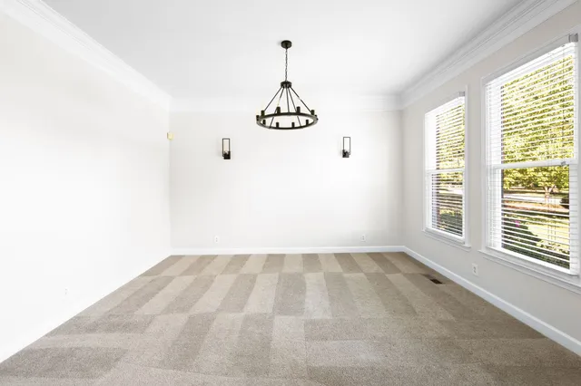 a view of a livingroom with wooden floor and a fireplace