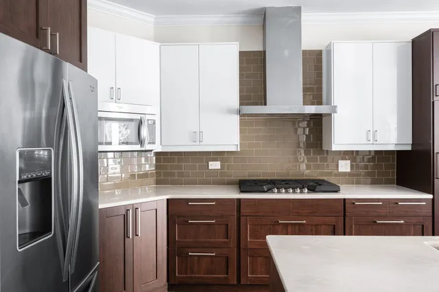 a view of a living room with a fireplace and a large window