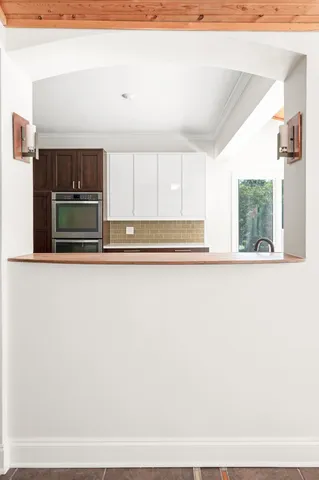 a view of an empty room with cabinet