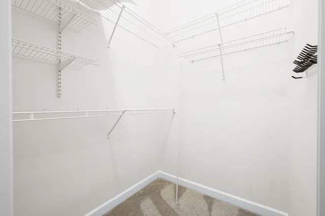 a view of a house with a yard and a garage