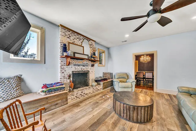 a kitchen with a sink a counter top space cabinets and a window