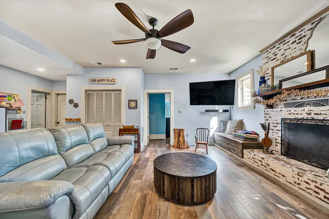 a kitchen with stainless steel appliances granite countertop a sink and a refrigerator