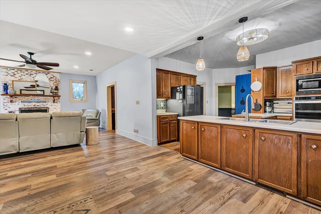 a bathroom with a sink a mirror and a shower