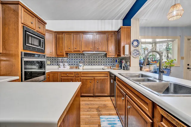 a view of backyard with outdoor seating and green space