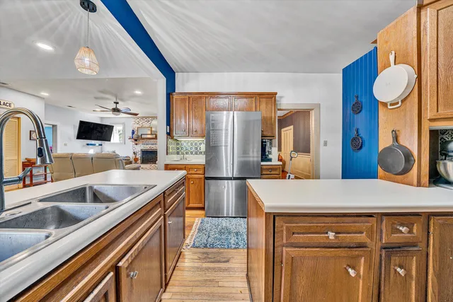 a view of a dining room with furniture wooden floor and chandelier