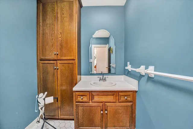 a bedroom with furniture and a wooden floor