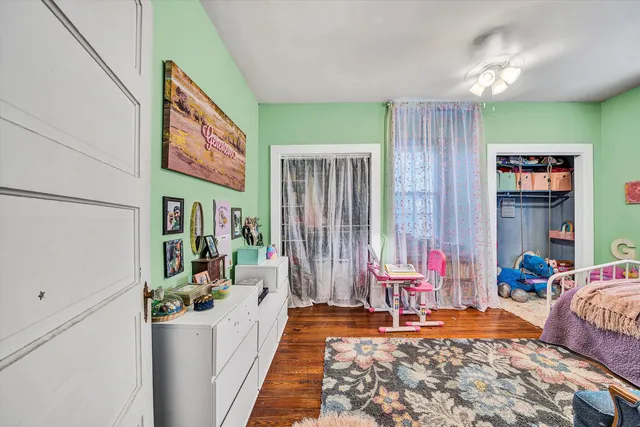 a view of a chairs and table on the wooden floor