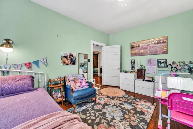 a view of a yard with plants and trees