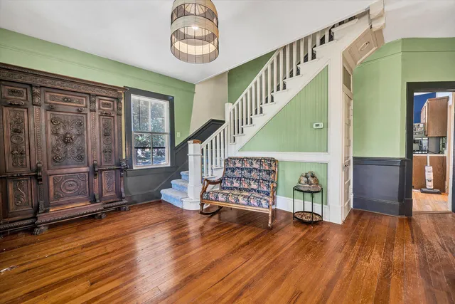 a view of a livingroom with furniture and a kitchen