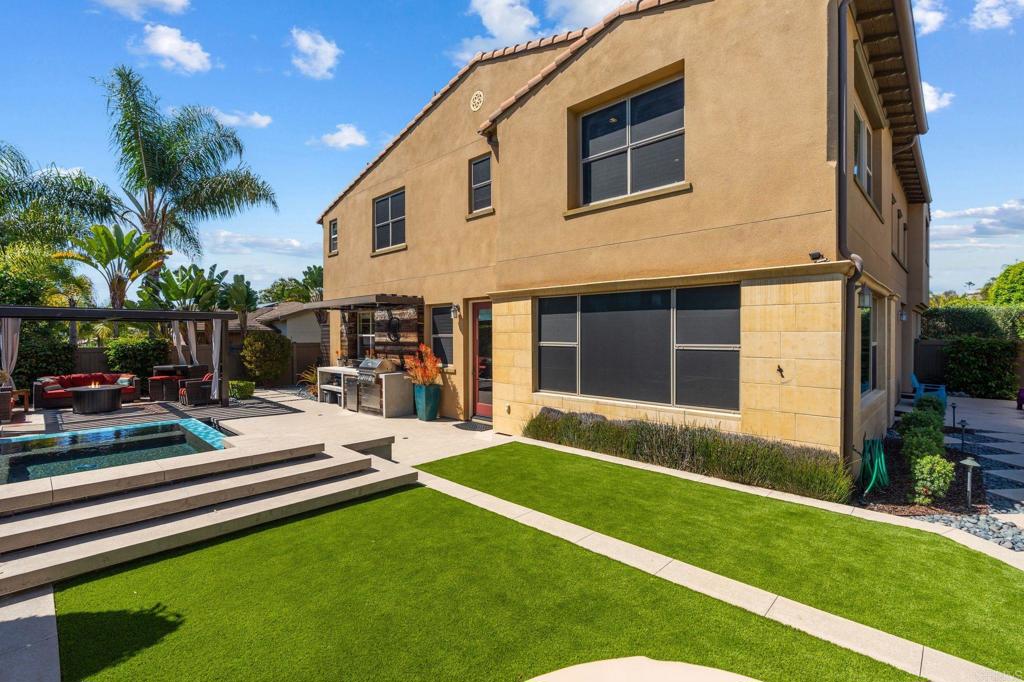 809 Dolphin Circle Encinitas, CA 92024 - Photo 54 of 71 a view of a house with a backyard and a patio