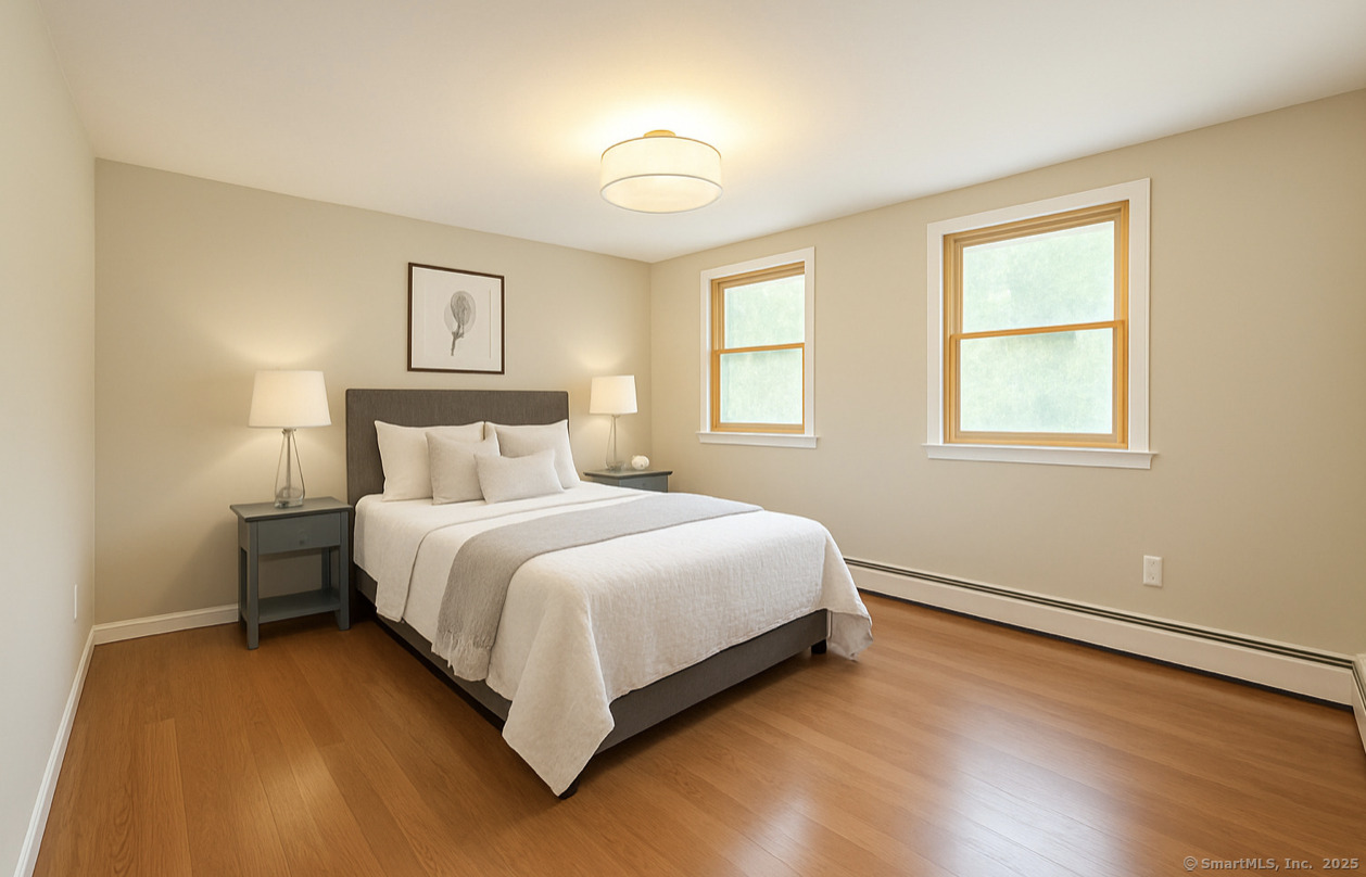 11 Pond Circle Road Westbrook, CT 06498 - Photo 13 of 22 a bedroom with a bed and a window