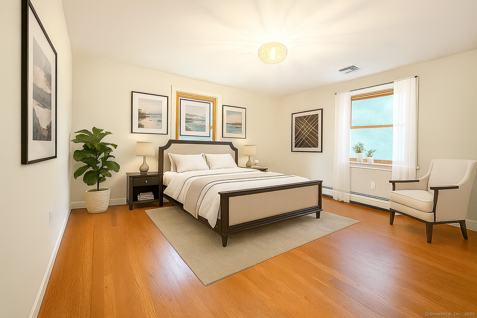 11 Pond Circle Road Westbrook, CT 06498 - Photo 17 of 22 a bed room with a bed and a potted plant