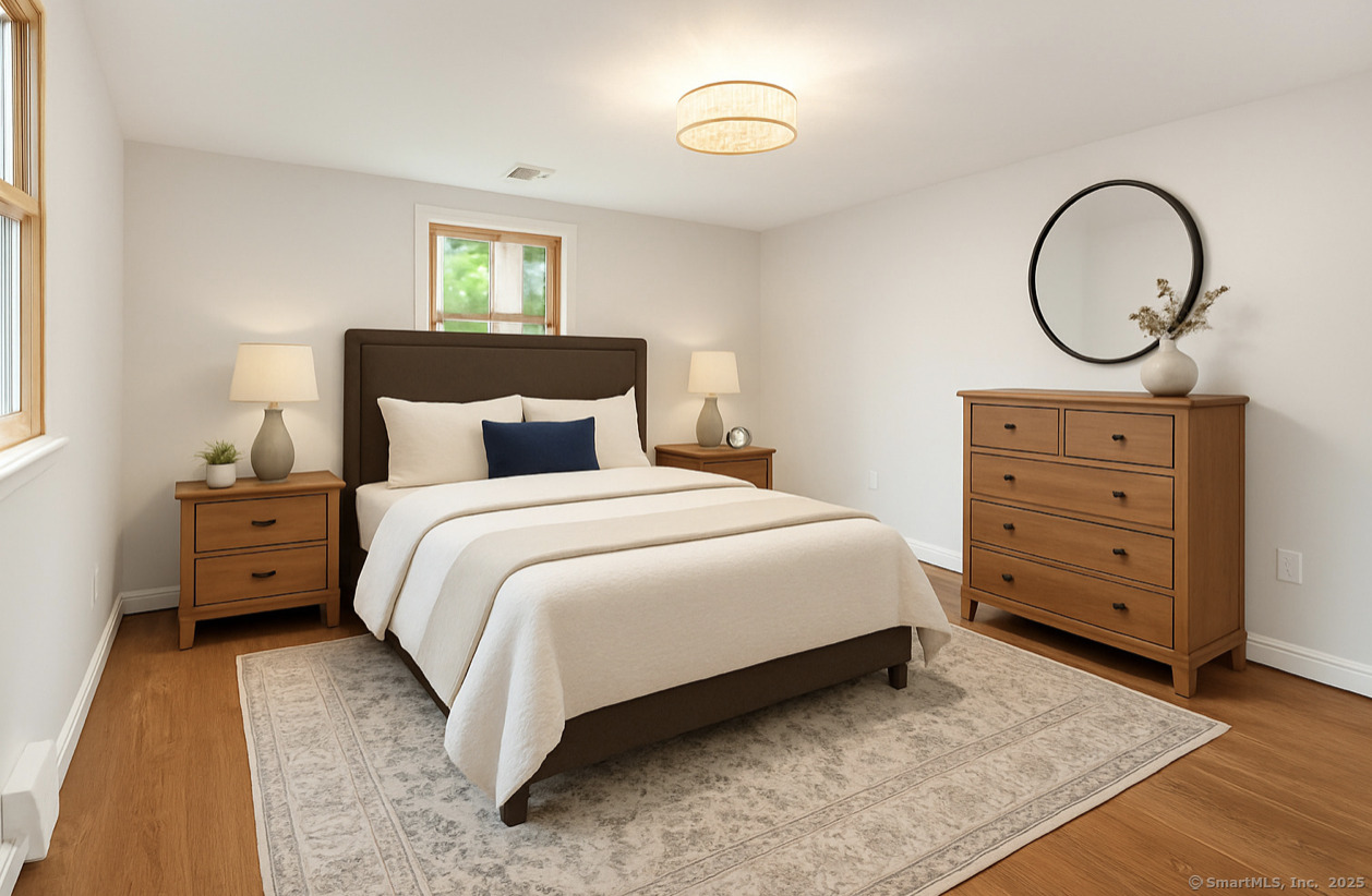 11 Pond Circle Road Westbrook, CT 06498 - Photo 5 of 22 a bedroom with a bed and a dresser