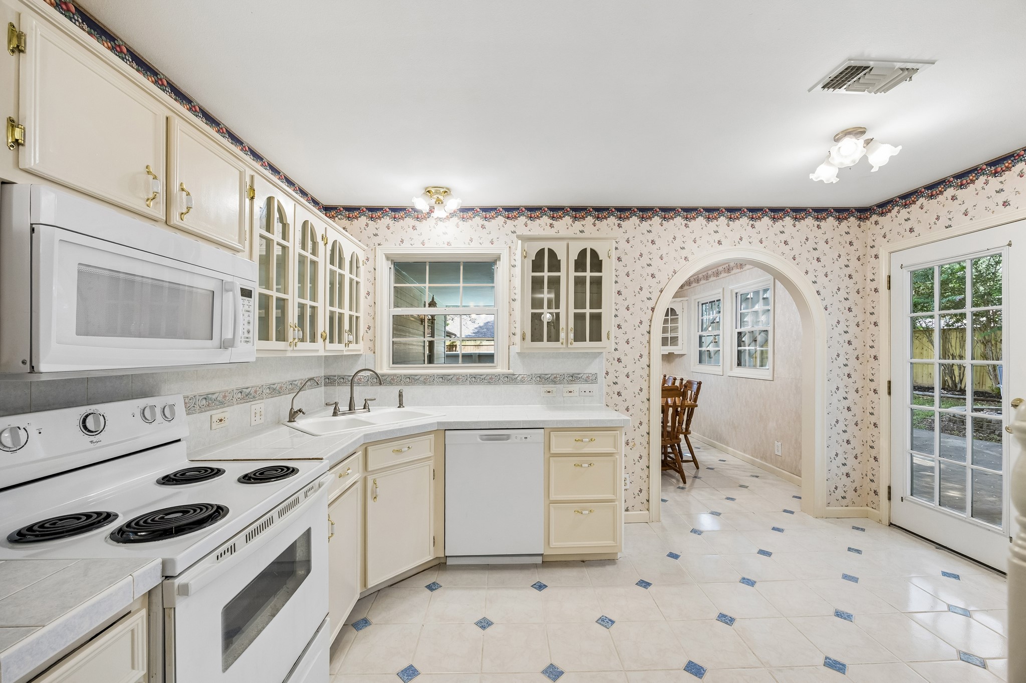 1003 Eagle Lake Road Sealy, TX 77474 - Photo 5 of 17 Kitchen leading to the outdoor entertaining area
