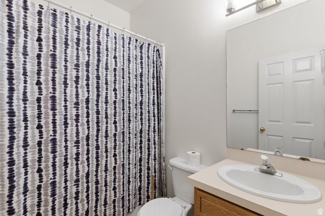134 West 475 South Ogden, UT 84404 - Photo 20 of 27 Bathroom featuring vanity and a shower with curtain