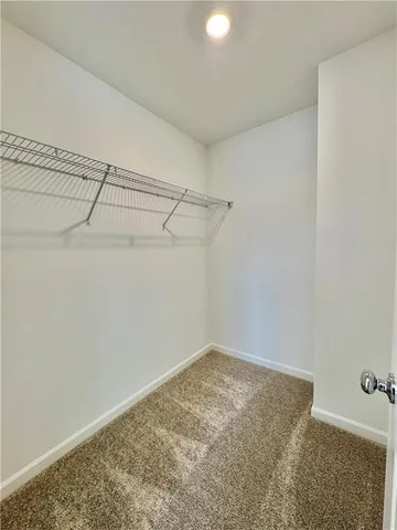 a view of a building with sitting area and furniture