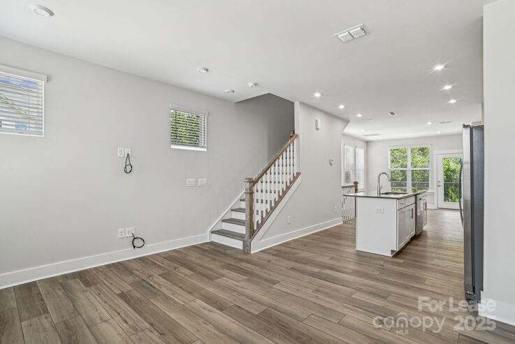 4375 Raleigh Street, Unit B1 Charlotte, NC 28213 - Photo 9 of 19 a view of an entryway with wooden floor