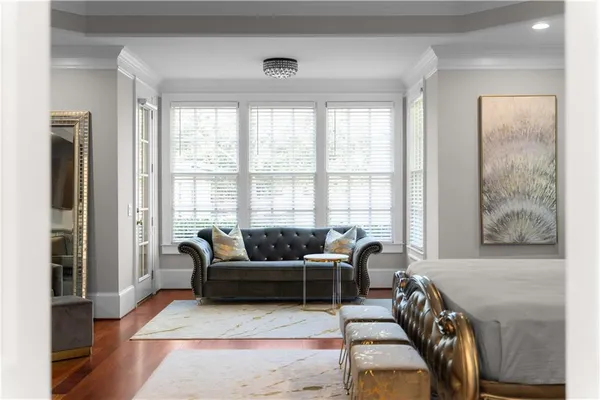 a living room with furniture and a lamp